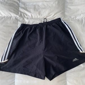 Black Adidas running shorts.